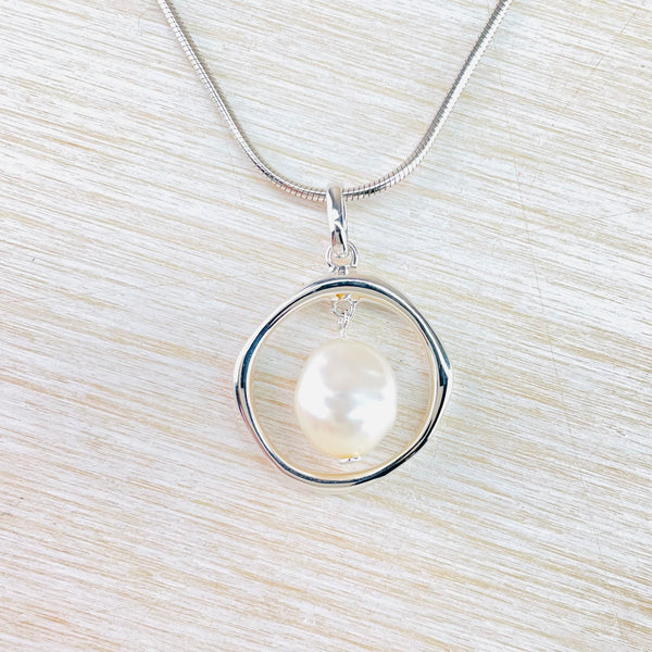 Circular Contemporary Sterling Silver and Fresh Water Pearl Necklace by 'JB Designs'.