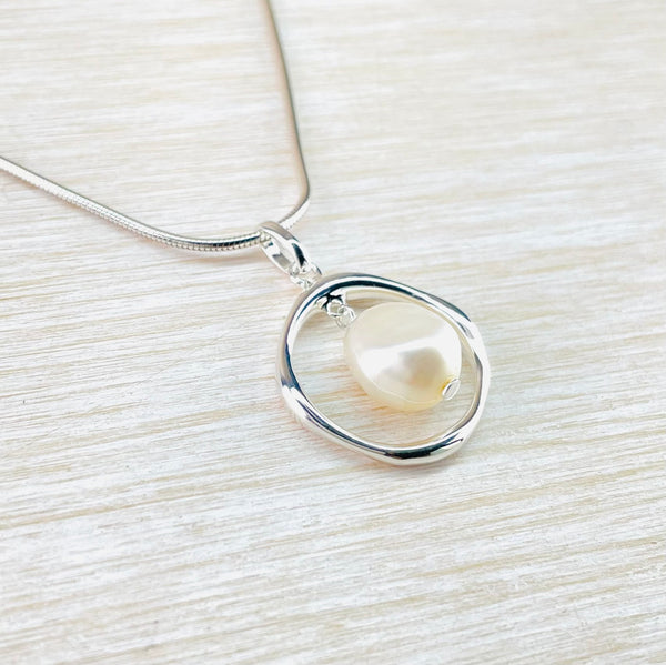 Circular Contemporary Sterling Silver and Fresh Water Pearl Necklace by 'JB Designs'.