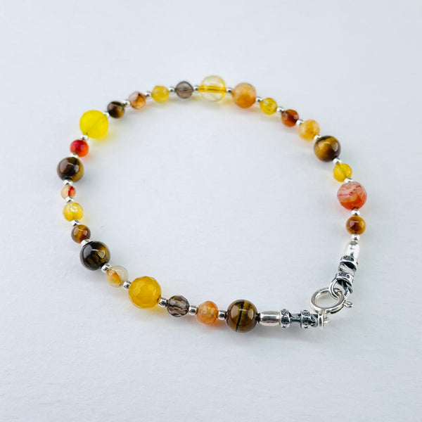 Mixed Brown and Yellow Bead Bracelet by Emily Merrix.