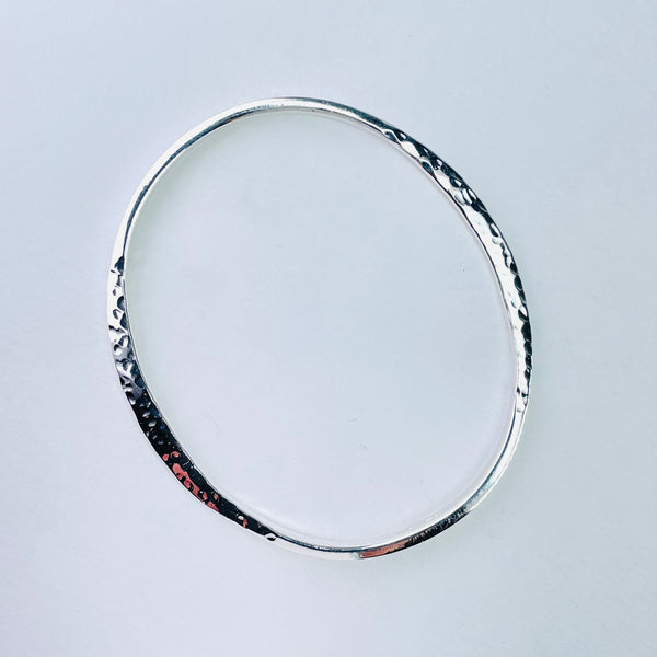 Hammered Flattened Edge Sterling Silver Bangle.