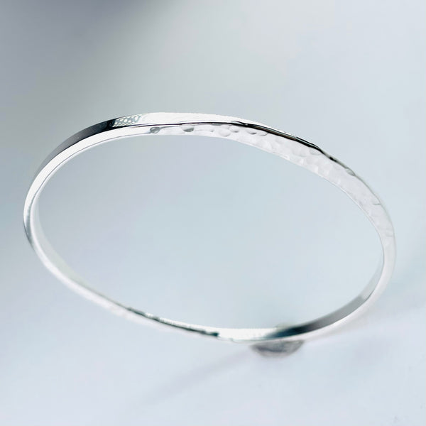 Hammered Flattened Edge Sterling Silver Bangle.