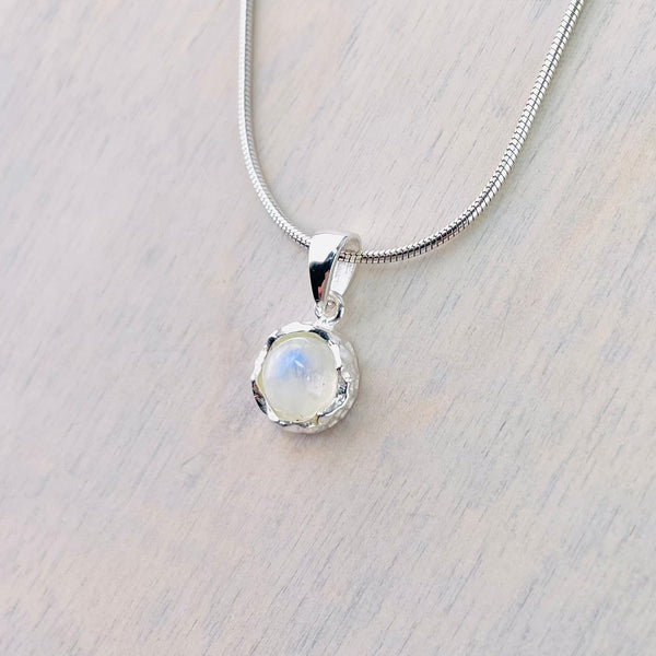 Small Textured Round Sterling Silver and Rainbow Moonstone Pendant.