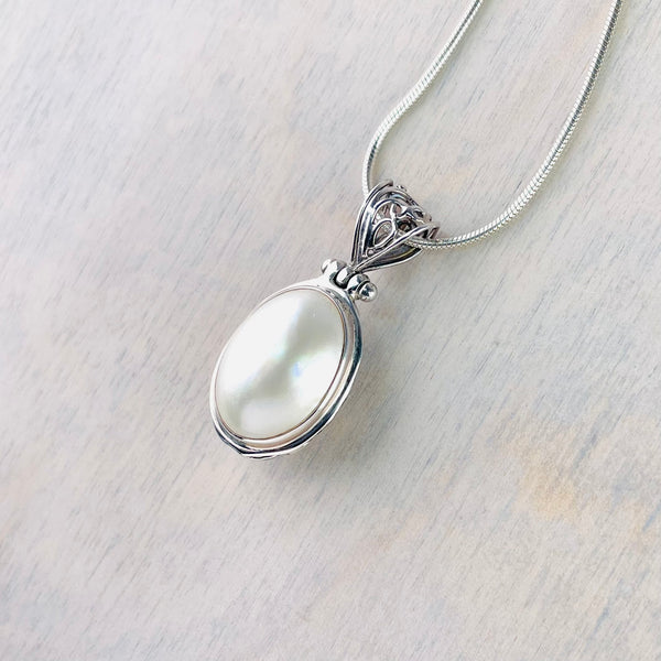 Silver and Oval Mabe Pearl Pendant.