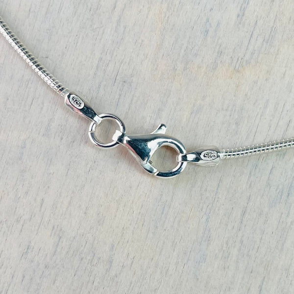 Double Twist Sterling Silver Pendant with a Single White Pearl.