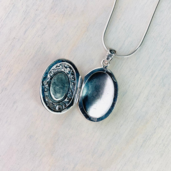 Silver and Abalone Shell Locket.