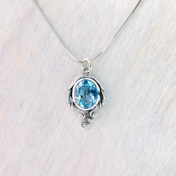 Art Nouveau Style Blue Topaz and Silver Pendant.