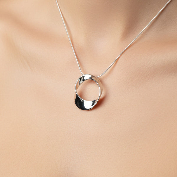 Sterling Silver Round Mobius Pendant by JB Designs.