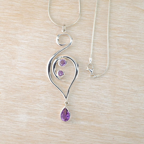 Long Sterling Silver Swirl Pendant with Amethyst Teardrop.