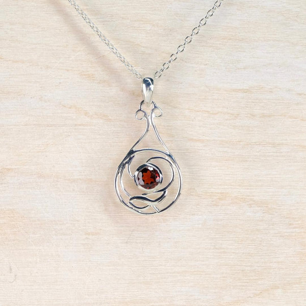 Sterling Silver and Garnet Art Nouveau Style Pendant.