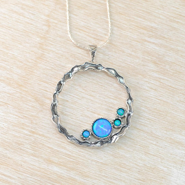 Sterling Silver Open Circle Pendant with Opals.