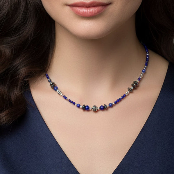 Necklace with blue beads and silver accents on a model