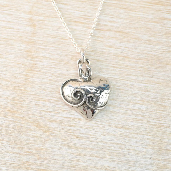 Hammered Sterling Silver Heart Pendant with Swirl Pattern Overlay.