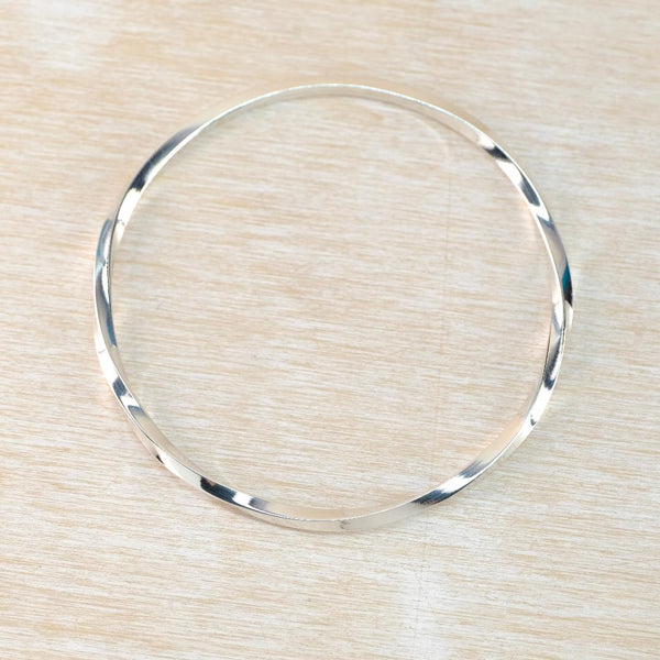 Sterling Silver Bangle with Twist Detail.