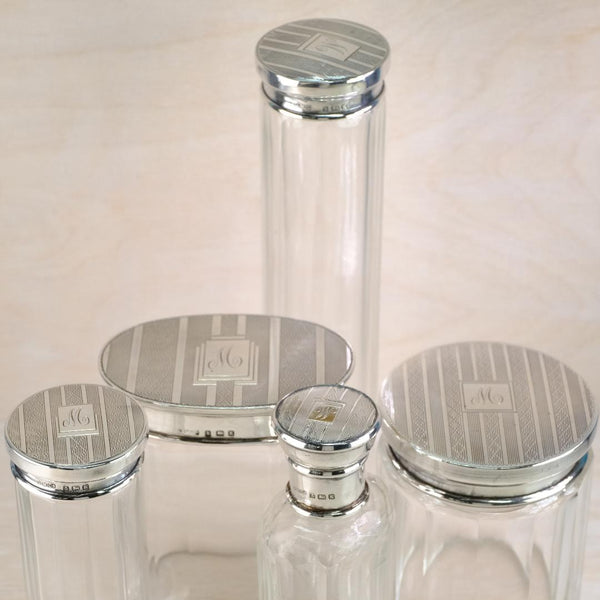 Five Art Deco Silver Topped Glass Pots,  Hallmarked in Birmingham, 1934