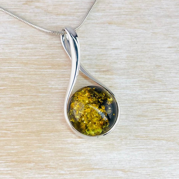 Green Amber and Sterling Silver Pendant.