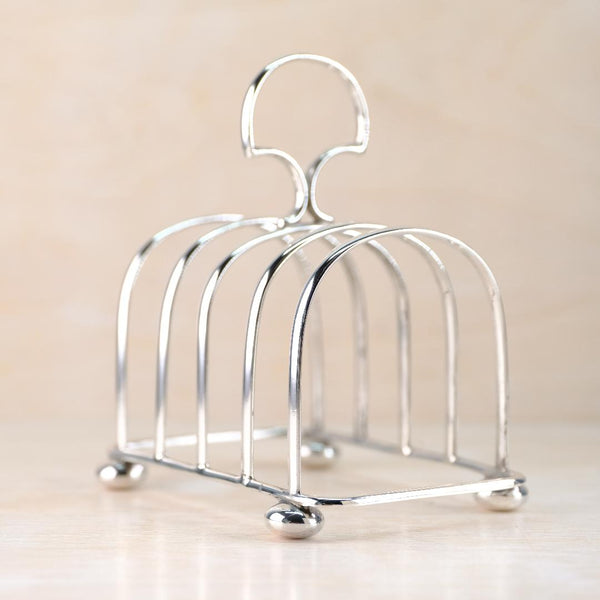 silver toast rack on a beige background
