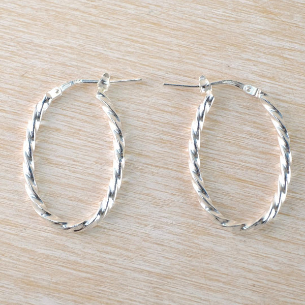 Sterling Silver Twist Hoop Earrings by JB Designs.