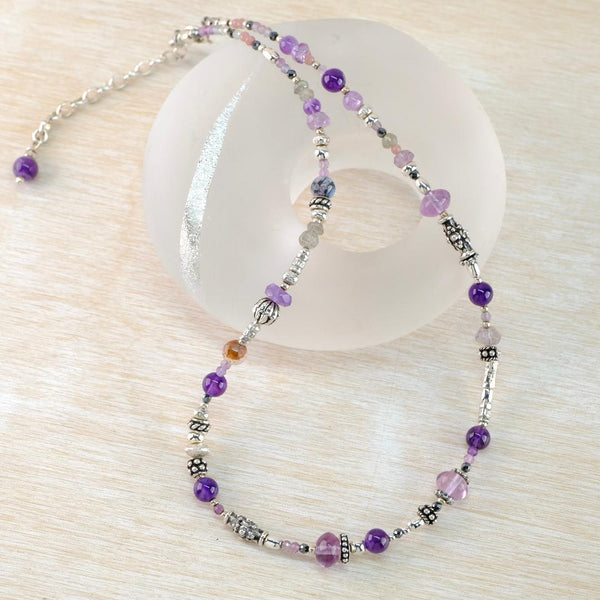 Asymmetric Gemstone and Silver Necklace With Mixed Amethysts by Emily Merrix.