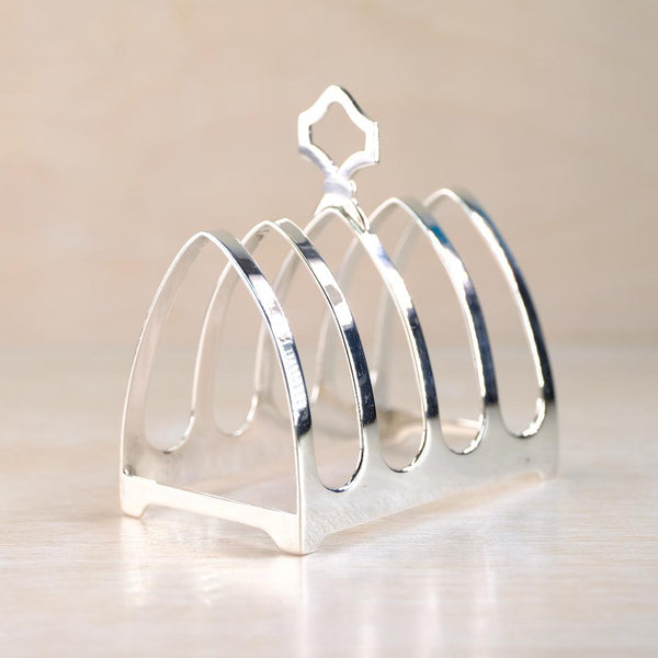 Silver toast rack on a beige background
