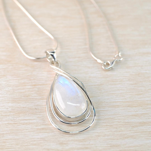 Large Teardrop Rainbow Moonstone Pendant with Silver Overlay.