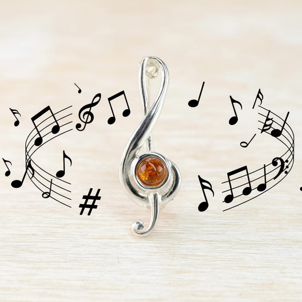 Sterling Silver and Amber Treble Clef Brooch.