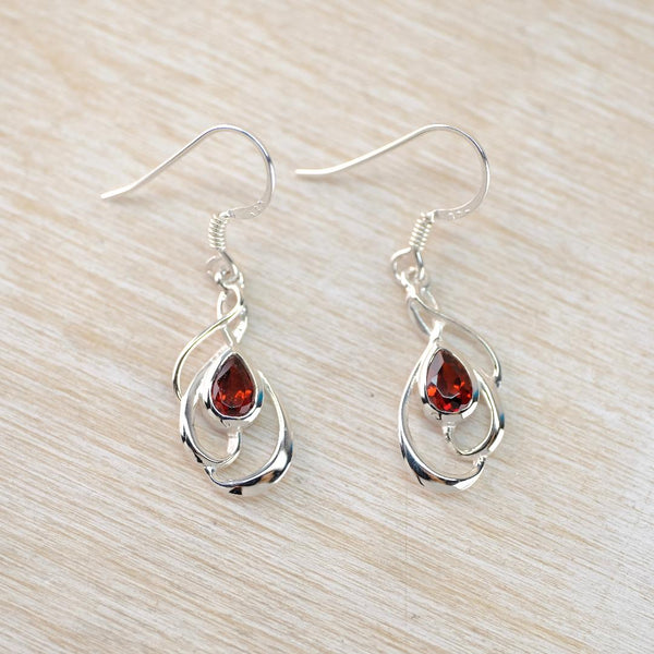 Silver Swirl and Faceted Garnet Drop Earrings.