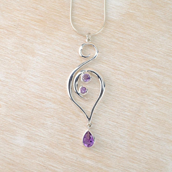 Long Sterling Silver Swirl Pendant with Amethyst Teardrop.