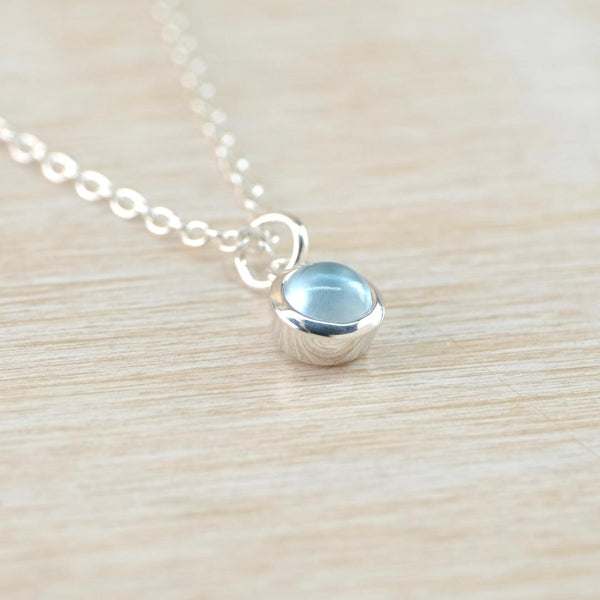 Petite Birthstone Pendant in Sterling Silver and Blue Topaz.