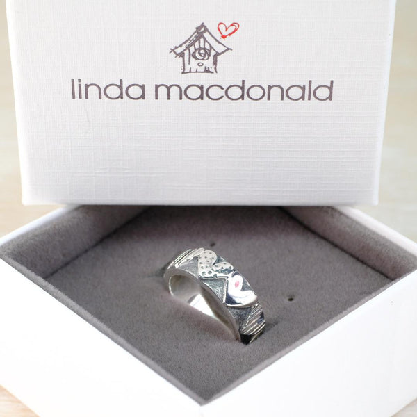 Silver ring with hearts all the way around