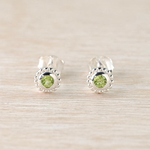 Sterling Silver Peridot Stud Earrings with Dotted Surround.