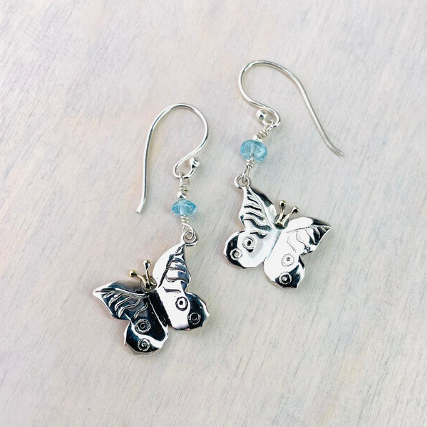 Silver Butterfly Drop Earrings With Blue Topaz Beads.