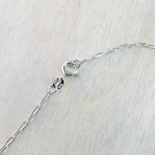 Delicate Teardrop Blue Topaz and Silver Pendant with CZ.