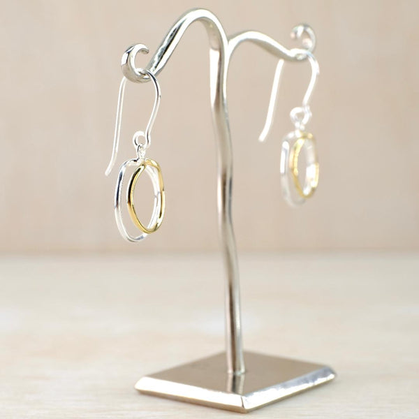 Silver Circles Drop Earrings with Gold-Plated Details.