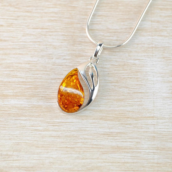 Amber Pendant with Decorative Sterling Silver Setting.
