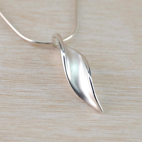 Satin Silver Pendant with Twisty Leaf Design.