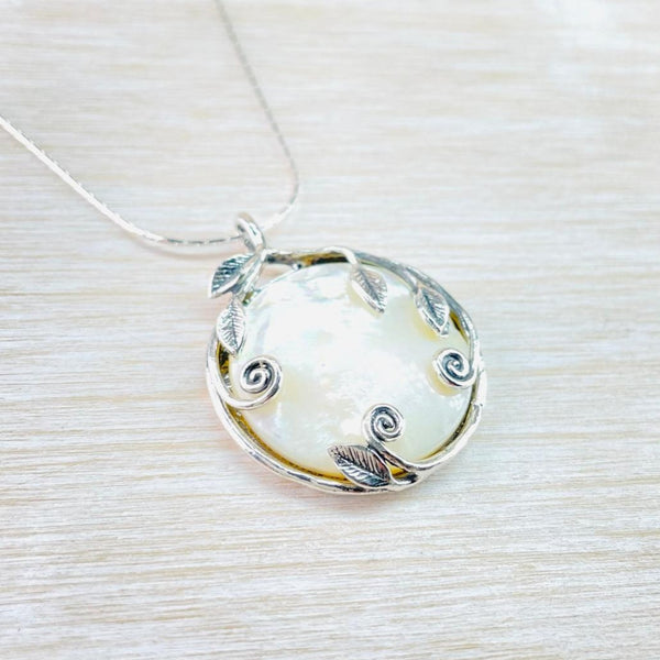 Decorative Sterling Silver and Mother of Pearl Pendant.