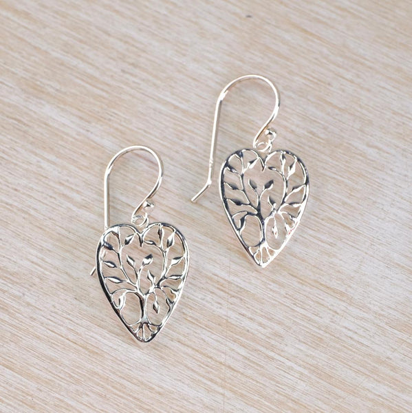 Silver heart-shaped earrings with intricate design of the tree of life