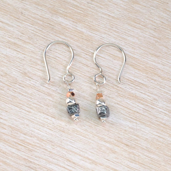 Pair of  smaller silver earrings with interesting beads in bright silver, grey and black.