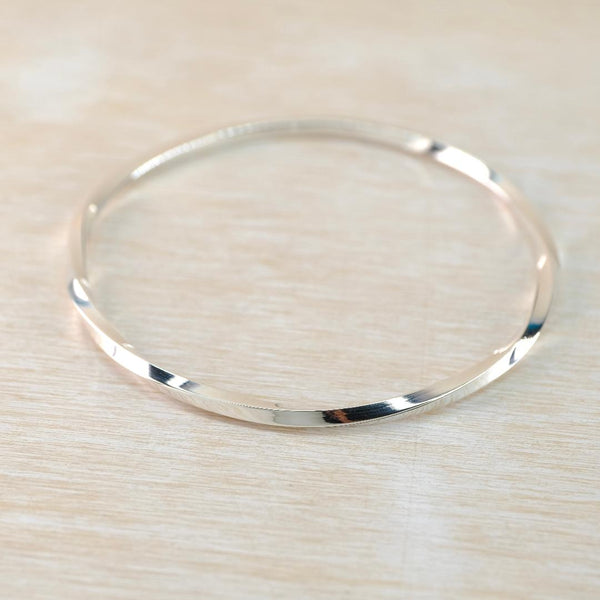 Sterling Silver Bangle with Twist Detail.