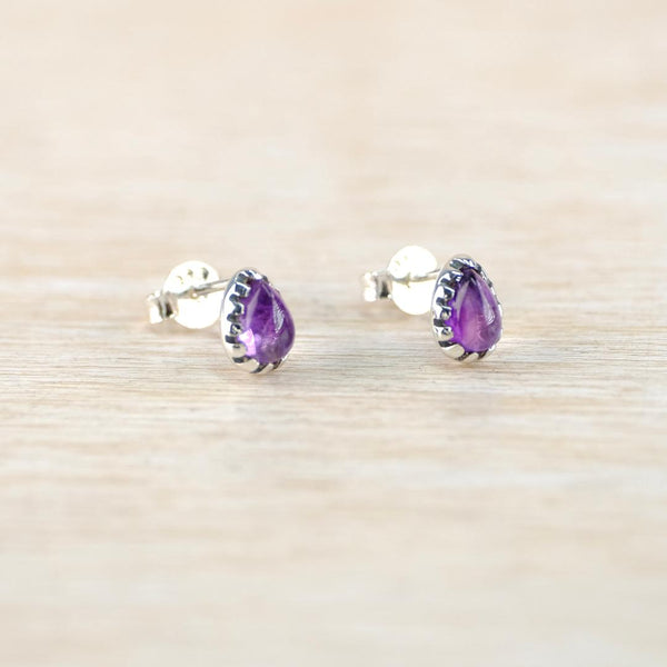 Silver and Amethyst Teardrop Stud Earrings With Scalloped Edge.