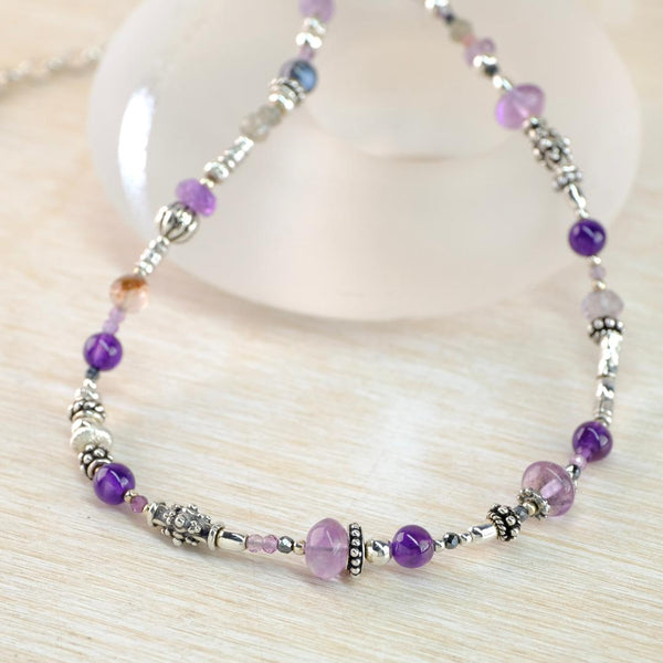 Asymmetric Gemstone and Silver Necklace With Mixed Amethysts by Emily Merrix.