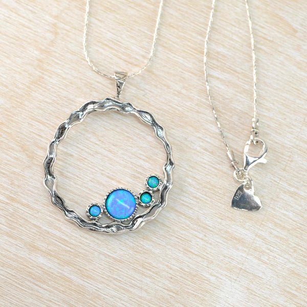 Sterling Silver Open Circle Pendant with Opals.