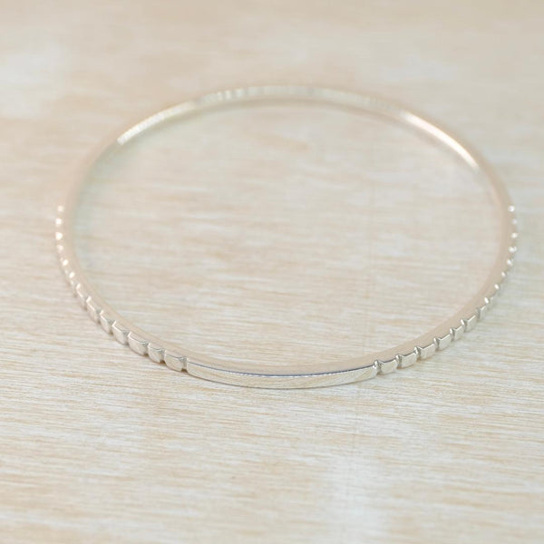 Sterling Silver Bangle with Decorative Detail.