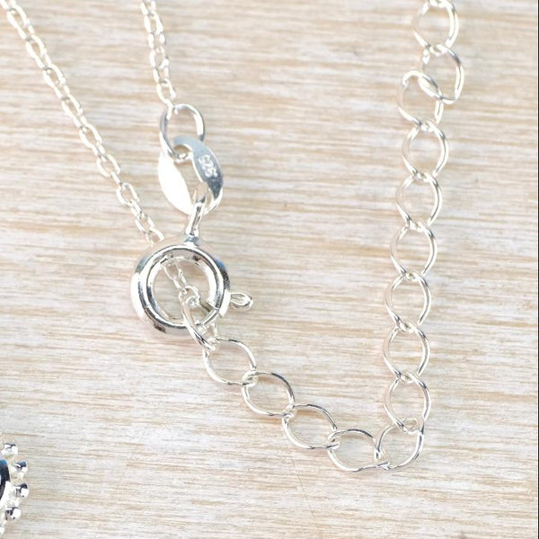 Small Round Silver and Peridot Pendant.