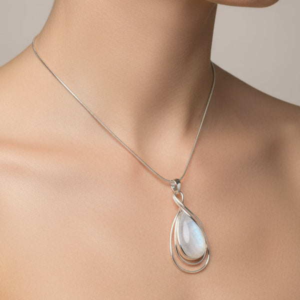 Large Teardrop Rainbow Moonstone Pendant with Silver Overlay.
