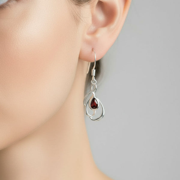 Silver Swirl and Faceted Garnet Drop Earrings.