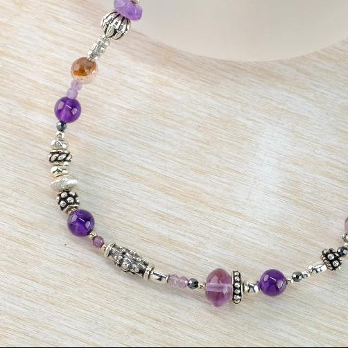 Asymmetric Gemstone and Silver Necklace With Mixed Amethysts by Emily Merrix.
