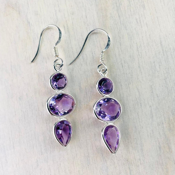 Sterling Silver and Faceted Amethyst Triple Stone Drop Earrings.