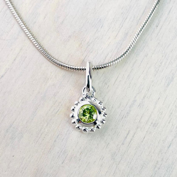 Small Round Silver and Peridot Pendant.