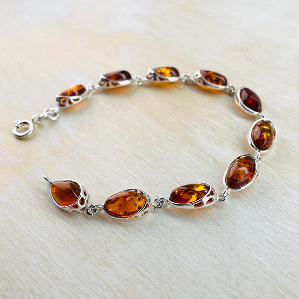 Sterling Silver and Oval Cognac Amber Link Bracelet.